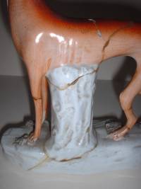 Staffordshire figure of a dog before restoration.
CLICK FOR ENLARGED IMAGE.